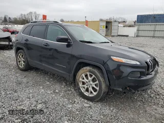 2015 Jeep Cherokee Latitude with VIN 1C4PJLCB9FW706934, listed as a Copart auction lot 52696105 with 125,205 mi miles and Salvage Title. Bid and sale history available at DreamBid. Image 4.