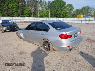 2013 BMW 3 Series 328i with VIN WBA3C1C54DK103415, listed as a IAAI auction lot 42147590 with 113,188 mi miles and . Bid and sale history available at carsss.com. Image 3.