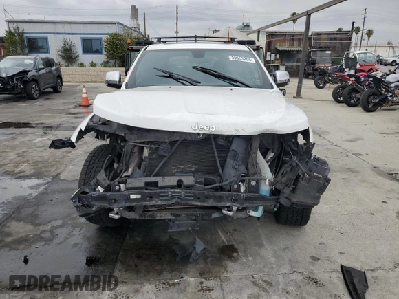 2015 Jeep Grand Cherokee Overland with VIN 1C4RJECG7FC872175, listed as a Copart auction lot 50653205 with 117,433 mi miles and Salvage title. Bid and sale history available at DreamBid. Image 5.
