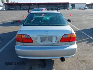 1999 Honda Civic EX with VIN JHMEJ8648XS000823, listed as a IAAI auction lot 41479594 with 299,294 mi miles. Bid and sale history available at carsss.com. Image 17.