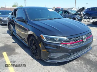 2019 Volkswagen Jetta GLI S z VIN 3VW6T7BU4KM255418, wystawiony jako IAAI lot #42141020 z przebiegiem 74 066 mil mil oraz . Historia ofert i sprzedaży dostępna na DreamBid. Obrazek 1.