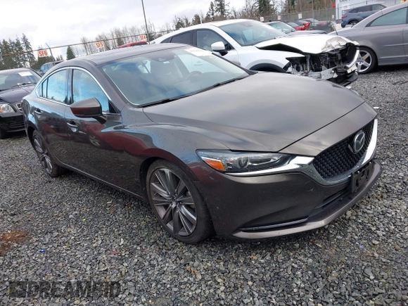 2018 Mazda 6 Grand Touring with VIN JM1GL1TYXJ1301545, listed as a IAAI auction lot 41131114 with 34,089 mi miles and . Bid and sale history available at DreamBid. Image 1.