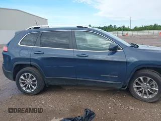 2021 Jeep Cherokee Latitude Lux with VIN 1C4PJLMX2MD107165, listed as a IAAI auction lot 42456893 with 62,625 mi miles and . Bid and sale history available at DreamBid. Image 14.