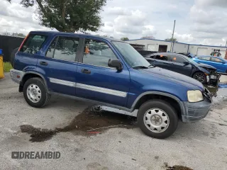1999 Honda CR-V LX with VIN JHLRD1840XC037215, listed as a Copart auction lot 71116744 with 156,385 mi miles and Salvage Title. Bid and sale history available at carsss.com. Image 4.