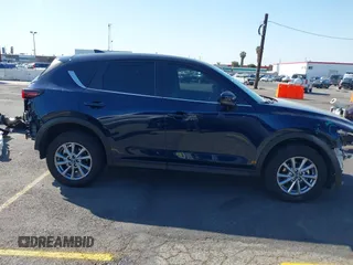 2023 Mazda CX-5 S Carbon Edition z VIN JM3KFBCM7P0197669, wystawiony jako IAAI lot #41992110 z przebiegiem 15 476 mil mil oraz . Historia ofert i sprzedaży dostępna na DreamBid. Obrazek 13.