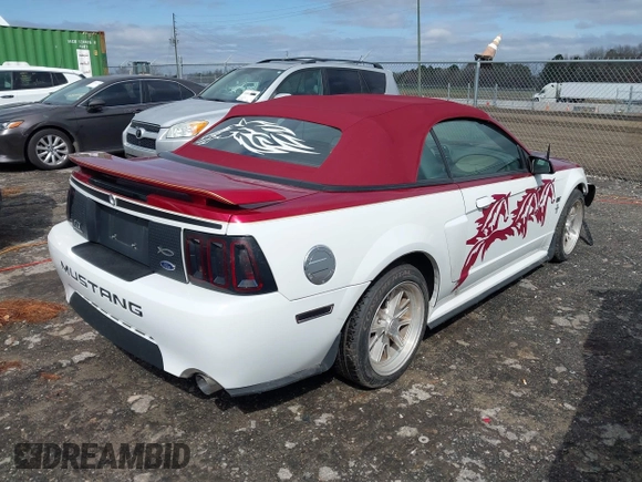 2002 Ford Mustang GT Deluxe z VIN 1FAFP45X62F165902, wystawiony jako IAAI lot #41814507 z przebiegiem 129 528 mil mil oraz . Historia ofert i sprzedaży dostępna na DreamBid. Obrazek 4.