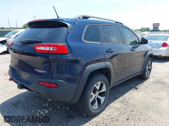 2015 Jeep Cherokee Trailhawk with VIN 1C4PJMBS3FW704622, listed as a IAAI auction lot 42465702 with 96,831 mi miles and . Bid and sale history available at DreamBid. Image 4.