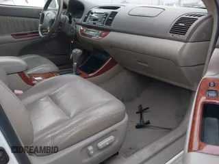 2004 Toyota Camry LE with VIN 4T1BF30K74U073676, listed as a IAAI auction lot 41668460 with 249,847 mi miles. Bid and sale history available at carsss.com. Image 5.