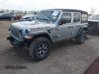 2021 Jeep Wrangler Unlimited Rubicon with VIN 1C4HJXFNXMW560512, listed as a IAAI auction lot 42124812 with 18,034 mi miles and . Bid and sale history available at DreamBid. Image 2.