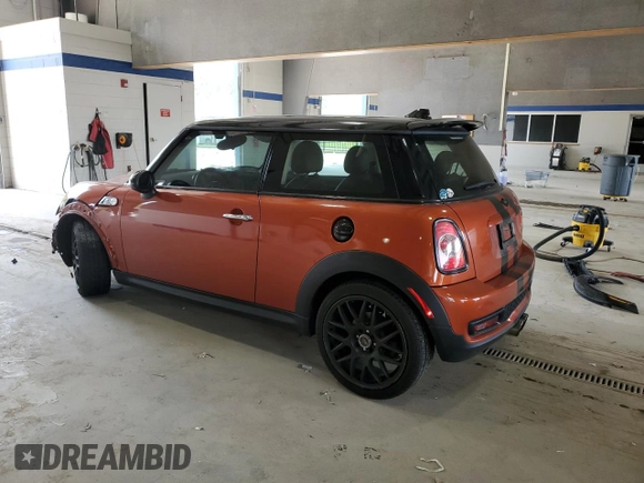 2013 MINI Hardtop S with VIN WMWSV3C52DT396176, listed as a Copart auction lot 59207165 with 104,194 mi miles and Salvage title. Bid and sale history available at DreamBid. Image 2.