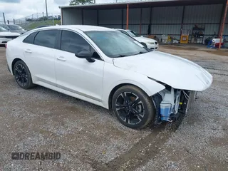 2022 Kia K5 GT-Line z VIN 5XXG64J24NG132334, wystawiony jako IAAI lot #42234844 z przebiegiem 49 732 mil mil oraz . Historia ofert i sprzedaży dostępna na DreamBid. Obrazek 1.