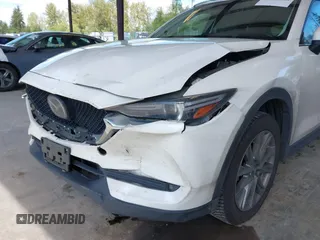 2020 Mazda CX-5 Grand Touring with VIN JM3KFBDM2L0863944, listed as a IAAI auction lot 42150805 with 63,932 mi miles and . Bid and sale history available at DreamBid. Image 6.