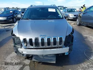 2015 Jeep Cherokee Latitude with VIN 1C4PJLCB8FW620336, listed as a IAAI auction lot 41634997 with 130,335 mi miles. Bid and sale history available at carsss.com. Image 13.