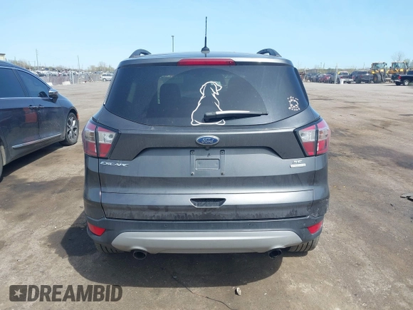 2017 Ford Escape SE z VIN 1FMCU0GD0HUE06774, wystawiony jako IAAI lot #42135955 z przebiegiem 141 807 mil mil oraz . Historia ofert i sprzedaży dostępna na DreamBid. Obrazek 17.