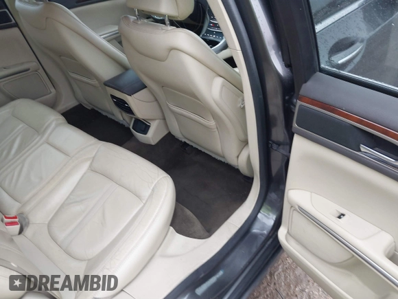 2015 Lincoln MKZ z VIN 3LN6L2G99FR604894, wystawiony jako IAAI lot #41433264 z przebiegiem 262 472 mil mil oraz . Historia ofert i sprzedaży dostępna na DreamBid. Obrazek 8.