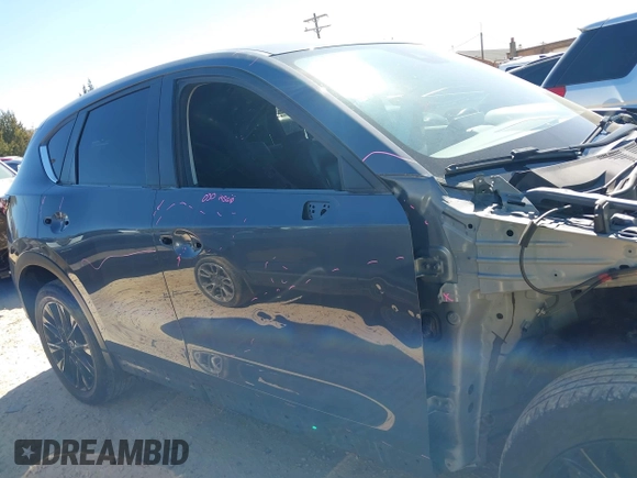 2022 Mazda CX-5 2.5 S Preferred Package with VIN JM3KFBCM8N0584325, listed as a IAAI auction lot 41794012 with 70,182 mi miles. Bid and sale history available at carsss.com. Image 13.