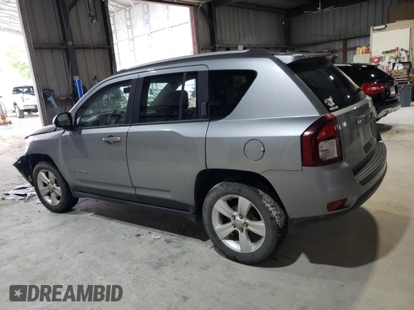 2016 Jeep Compass Sport with VIN 1C4NJCBA1GD512864, listed as a Copart auction lot 56297115 with 216,693 mi miles and Salvage title. Bid and sale history available at DreamBid. Image 2.