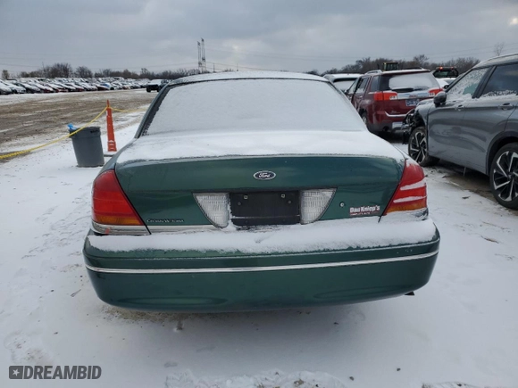 2000 Ford Crown Victoria with VIN 2FAFP73WXYX157746, listed as a Copart auction lot 82748804 with 56,820 mi miles and Salvage Title. Bid and sale history available at carsss.com. Image 6.