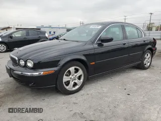 2002 Jaguar X-Type with VIN SAJEA51C02WC46124, listed as a Copart auction lot 50656395 with 50,815 mi miles and Salvage Title. Bid and sale history available at carsss.com. Image 1.