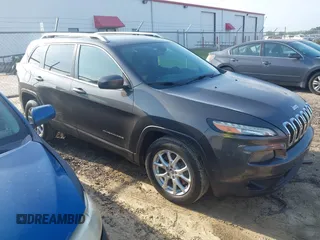 2014 Jeep Cherokee Latitude with VIN 1C4PJLCB6EW241897, listed as a IAAI auction lot 42128880 with 126,242 mi miles. Bid and sale history available at carsss.com. Image 1.
