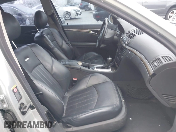 2003 Mercedes-Benz E-Class 5.5L AMG with VIN WDBUF76J93A351317, listed as a IAAI auction lot 41573446 with 144,119 mi miles. Bid and sale history available at carsss.com. Image 5.