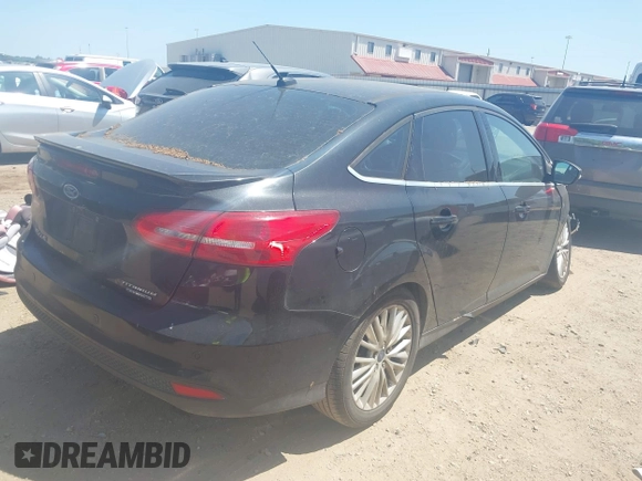 2015 Ford Focus Titanium with VIN 1FADP3J24FL385526, listed as a IAAI auction lot 42011712 with 162,696 mi miles and . Bid and sale history available at carsss.com. Image 4.