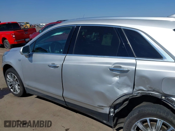 2017 Cadillac XT5 Luxury AWD z VIN 1GYKNDRS1HZ293429, wystawiony jako IAAI lot #42453704 z przebiegiem 92 347 mil mil oraz . Historia ofert i sprzedaży dostępna na DreamBid. Obrazek 14.