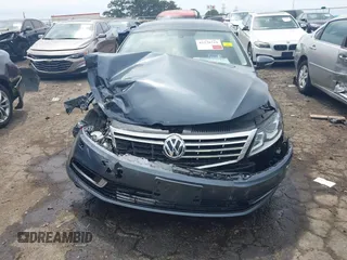 2013 Volkswagen CC Executive z VIN WVWGU7AN8DE520610, wystawiony jako IAAI lot #42278719 z przebiegiem 197 905 mil mil oraz . Historia ofert i sprzedaży dostępna na DreamBid. Obrazek 6.