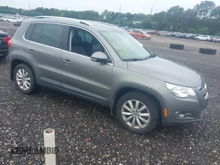 2011 Volkswagen Tiguan SEL with VIN WVGBV7AX9BW560576, listed as a IAAI auction lot 42706795 with 127,412 mi miles and . Bid and sale history available at DreamBid. Image 1.