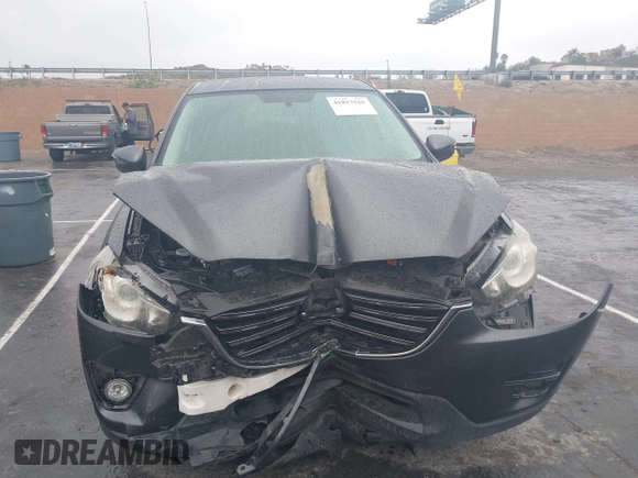 2016 Mazda CX-5 Touring with VIN JM3KE2CY7G0630056, listed as a IAAI auction lot 41817525 with 97,844 mi miles and . Bid and sale history available at DreamBid. Image 12.
