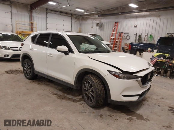 2018 Mazda CX-5 S Premium with VIN JM3KFBDM1J1412088, listed as a IAAI auction lot 41497431 with 65,532 mi miles and . Bid and sale history available at DreamBid. Image 1.