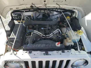 2000 Jeep Wrangler Sahara with VIN 1J4FA59SXYP764539, listed as a Copart auction lot 52707385 with 136,159 mi miles and Salvage title. Bid and sale history available at DreamBid. Image 12.