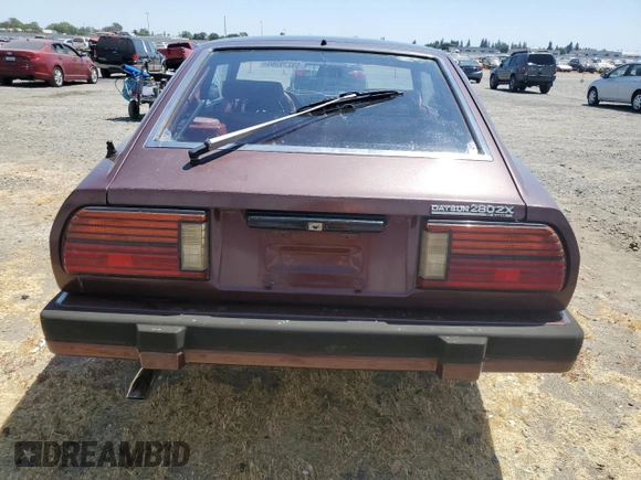 1982 Datsun 280ZX 2+2 z VIN JN1HZ06S5CX429361, wystawiony jako Copart lot #59239365 z przebiegiem 139 002 mil mil oraz Tytuł czysty. Historia ofert i sprzedaży dostępna na DreamBid. Obrazek 6.
