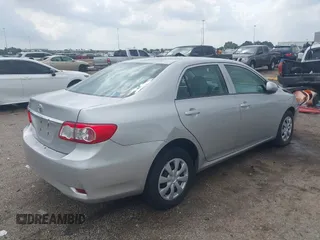 2013 Toyota Corolla L with VIN 5YFBU4EE8DP161765, listed as a IAAI auction lot 42109708 with 105,931 mi miles and . Bid and sale history available at DreamBid. Image 4.