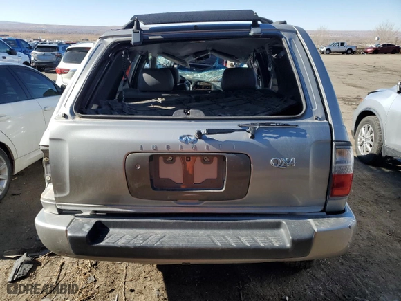 1999 Infiniti QX4 Luxury with VIN JNRAR07Y5XW063964, listed as a Copart auction lot 41700115 with 144,825 mi miles and Salvage Title. Bid and sale history available at carsss.com. Image 6.