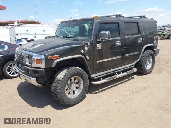 2003 Hummer H2 with VIN 5GRGN23U73H122756, listed as a IAAI auction lot 42194176 with 239,411 mi miles. Bid and sale history available at carsss.com. Image 17.