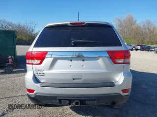 2013 Jeep Grand Cherokee Laredo with VIN 1C4RJFAG3DC586667, listed as a IAAI auction lot 42041524 with 100,635 mi miles. Bid and sale history available at carsss.com. Image 16.