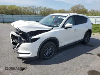 2021 Mazda CX-5 Touring z VIN JM3KFBCM4M1431739, wystawiony jako Copart lot #55441625 z przebiegiem 64 599 mil mil oraz Czysty tytuł • Clean title. Historia ofert i sprzedaży dostępna na DreamBid. Obrazek 1.