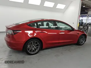 2022 Tesla Model 3 z VIN 5YJ3E1EA2NF291325, wystawiony jako Copart lot #60172435 z przebiegiem 128 928 mil mil oraz Czysty tytuł • Clean title. Historia ofert i sprzedaży dostępna na DreamBid. Obrazek 3.