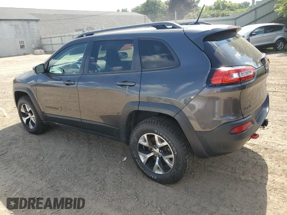 2014 Jeep Cherokee Trailhawk with VIN 1C4PJMBS4EW187085, listed as a Copart auction lot 64106985 with 166,467 mi miles and Clean title. Bid and sale history available at DreamBid. Image 2.