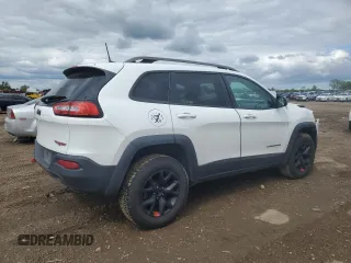 2016 Jeep Cherokee Trailhawk with VIN 1C4PJMBS8GW359461, listed as a Copart auction lot 57950705 with 146,124 mi miles and Salvage title. Bid and sale history available at DreamBid. Image 3.