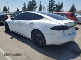 2020 Tesla Model S Performance with VIN 5YJSA1E42LF401157, listed as a Copart auction lot 55082875 with 60,376 mi miles and Salvage title. Bid and sale history available at DreamBid. Image 2.