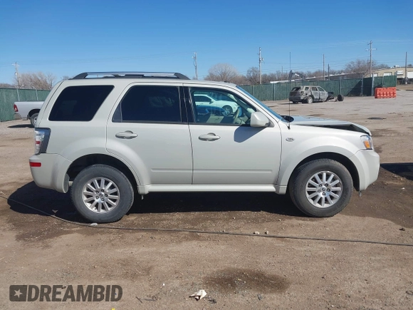 2009 Mercury Mariner Premier z VIN 4M2CU87G69KJ11232, wystawiony jako IAAI lot #41761605 z przebiegiem 63 239 mil mil oraz . Historia ofert i sprzedaży dostępna na DreamBid. Obrazek 13.