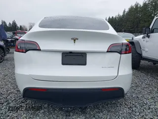2023 Tesla Model Y Long Range with VIN 7SAYGDEE7PF809164, listed as a IAAI auction lot 41828974 with 31,772 mi miles. Bid and sale history available at carsss.com. Image 16.