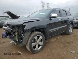 2016 Jeep Grand Cherokee Overland with VIN 1C4RJFCT6GC305170, listed as a Copart auction lot 52734175 with 127,402 mi miles and Salvage title. Bid and sale history available at DreamBid. Image 1.
