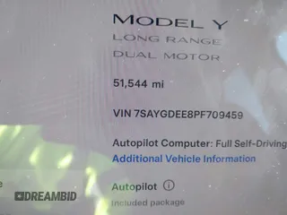 2023 Tesla Model Y Long Range with VIN 7SAYGDEE8PF709459, listed as a IAAI auction lot 41334108 with 51,544 mi miles. Bid and sale history available at carsss.com. Image 14.