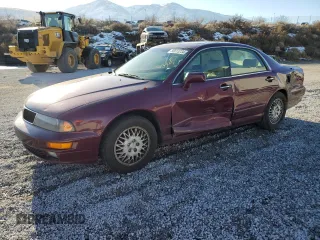 1998 Mitsubishi Diamante LS z VIN 6MMAP57P9WT007574, wystawiony jako Copart lot #85813234 z przebiegiem 134 695 mil mil oraz Szkody całkowita. Historia ofert i sprzedaży dostępna na DreamBid. Obrazek 1.