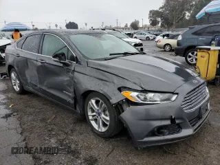 2016 Ford Fusion Titanium Hybrid z VIN 3FA6P0RU5GR356987, wystawiony jako Copart lot #48211775 z przebiegiem 145 192 mil mil oraz Szkoda całkowita • Salvage title. Historia ofert i sprzedaży dostępna na DreamBid. Obrazek 4.