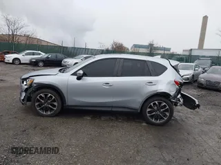 2016 Mazda CX-5 Grand Touring with VIN JM3KE4DY4G0712465, listed as a IAAI auction lot 41859217 with 61,806 mi miles and . Bid and sale history available at carsss.com. Image 15.