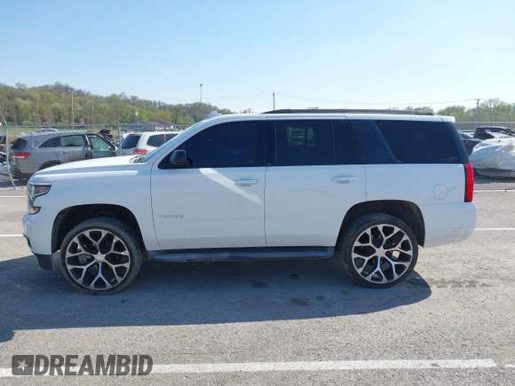 2015 Chevrolet Tahoe LT with VIN 1GNSCBKCXFR552071, listed as a IAAI auction lot 41972157 with 214,738 mi miles and . Bid and sale history available at DreamBid. Image 14.